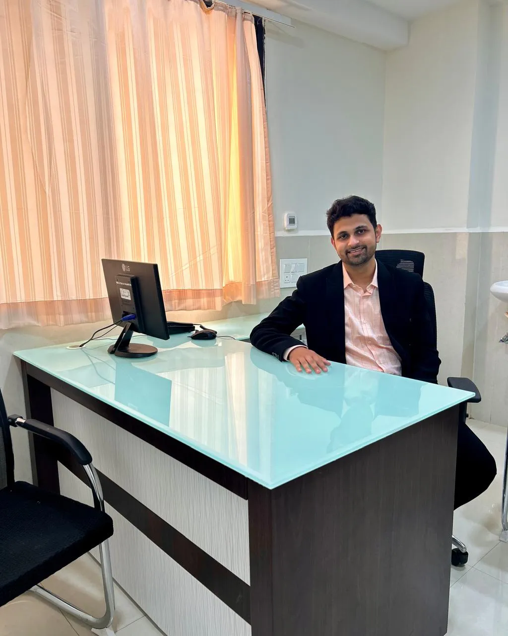 Dr. Nikhil Karwande at his consultation desk, OPD No. 6, First Floor